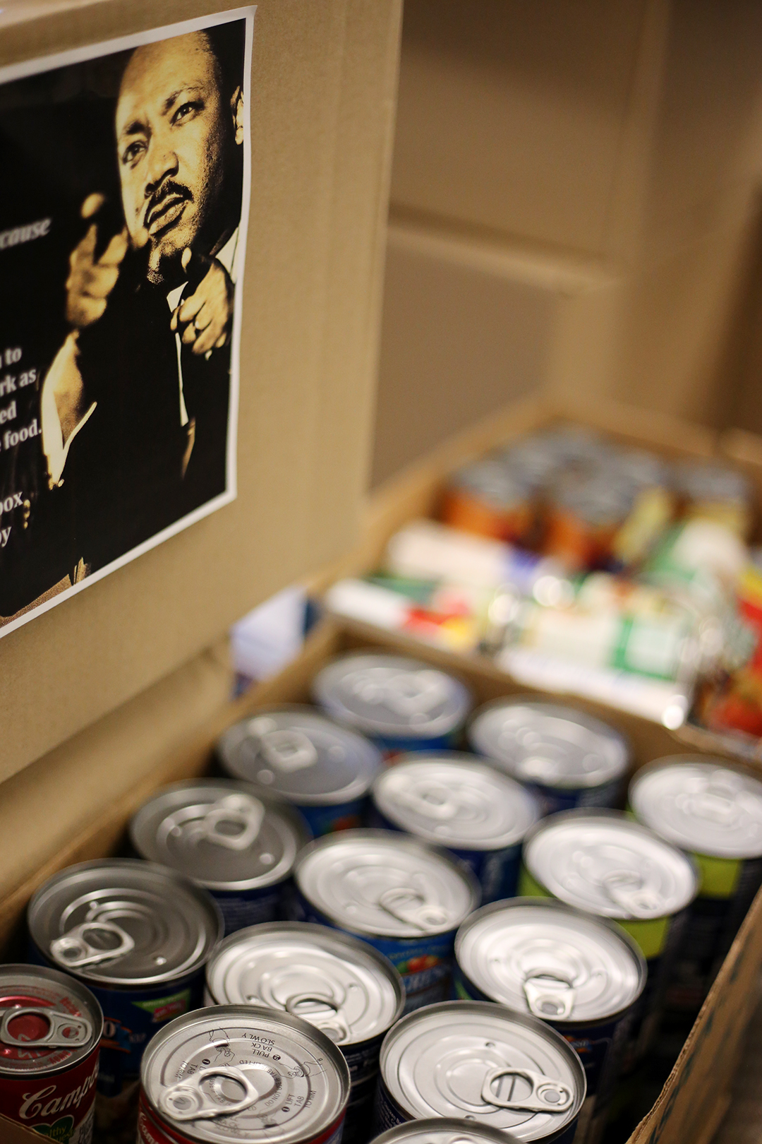 Canned food in a box. MLK on a poster.