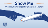 A finger points at a pad. Show me. A communication tool for emergency shelters.